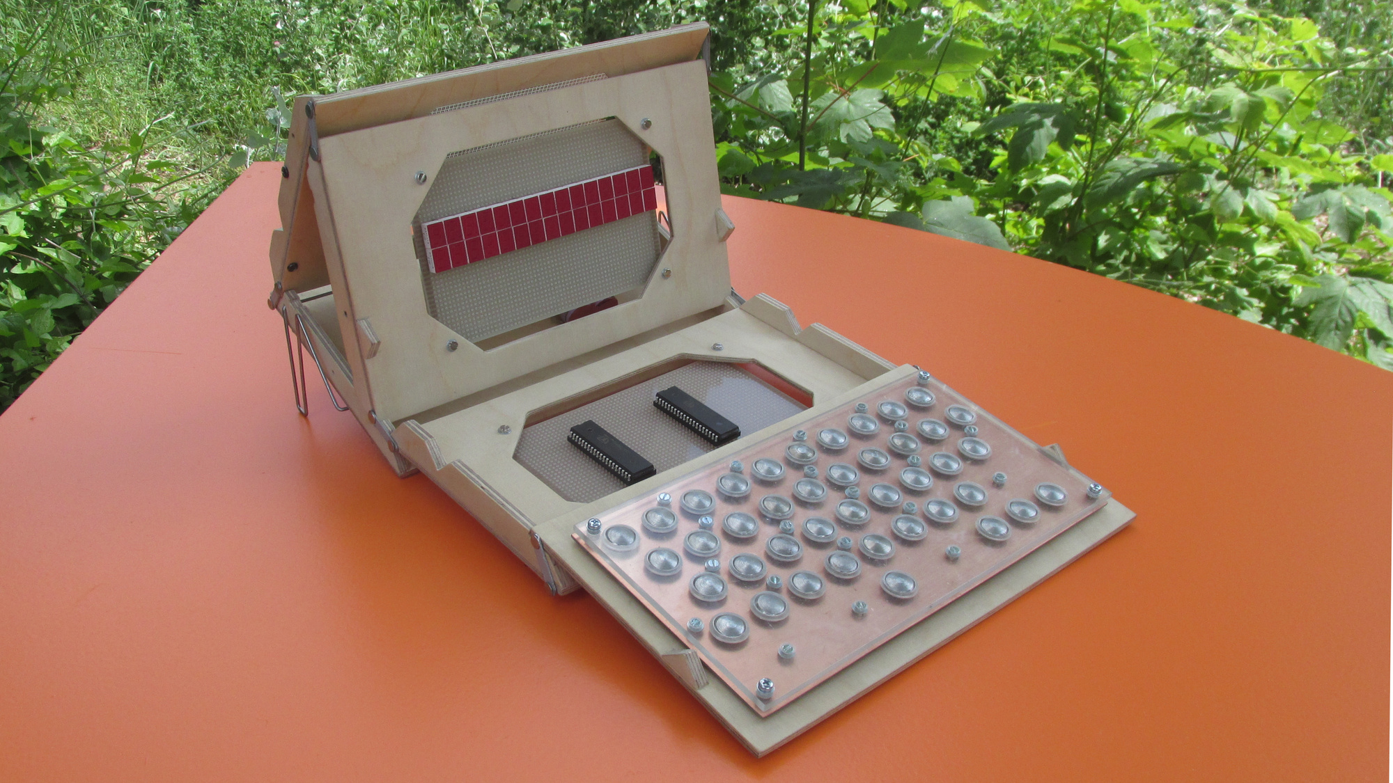 Prototype of the Zerocat Mini Machine, unfolded - visible is the keyboard and a LED display in a wooden frame