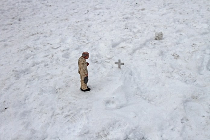 Funeral for a concrete figure. Anderletch, Belgium. Cement Eclipses -By Isaac Cordal 2013 in 12