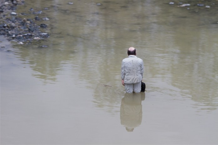 Waiting for climate change. Nantes, France. Cement Eclipses -By Isaac Cordal 2013 in 15