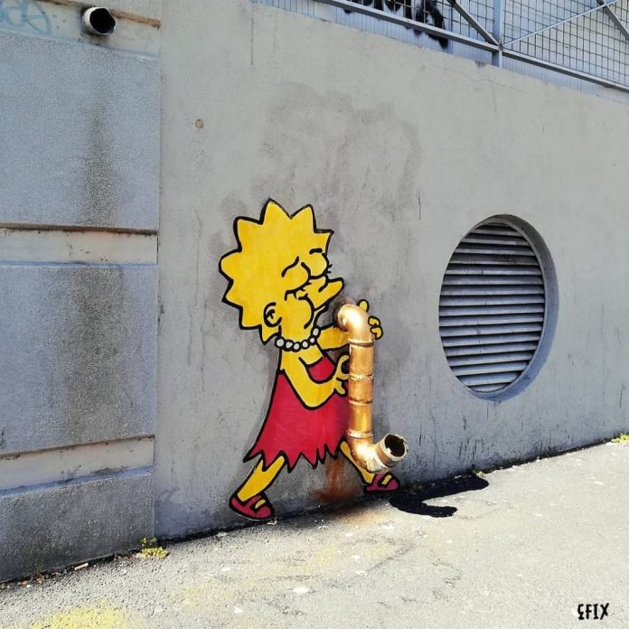 A street art piece by EFIX featuring Lisa Simpson from The Simpsons, painted on a wall, playing a saxophone cleverly formed by a golden urban pipe. The design merges the existing pipe with Lisa's iconic red dress and saxophone-playing pose. The background includes a circular vent and a textured concrete surface, creating a playful integration of street architecture and pop culture.