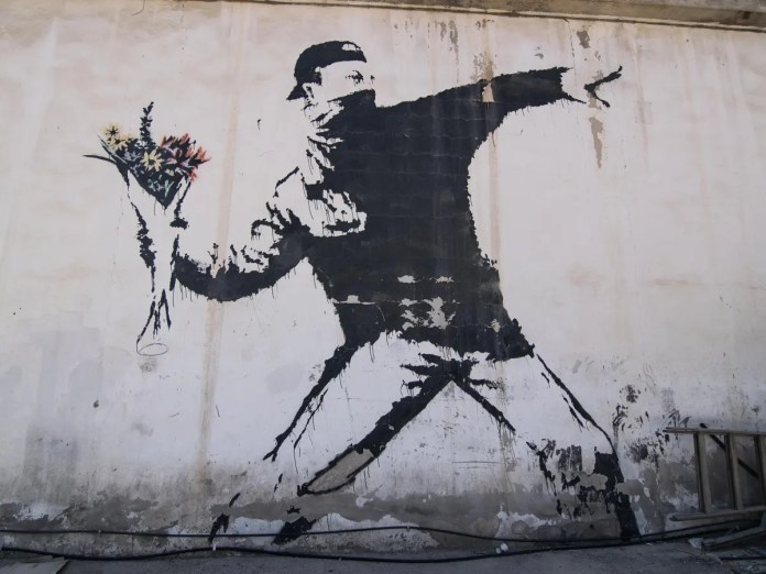 The Flower Thrower, Flower Bomber, Rage, or Love is in the Air is a 2003 stencil mural in Beit Sahour in the West Bank