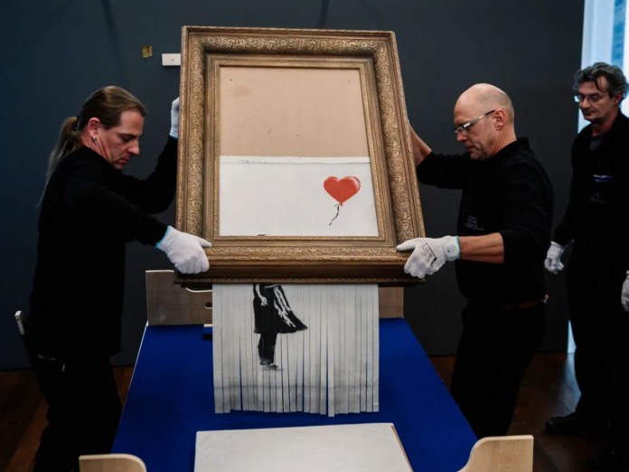 the Girl with Balloon Shattered at auction house.