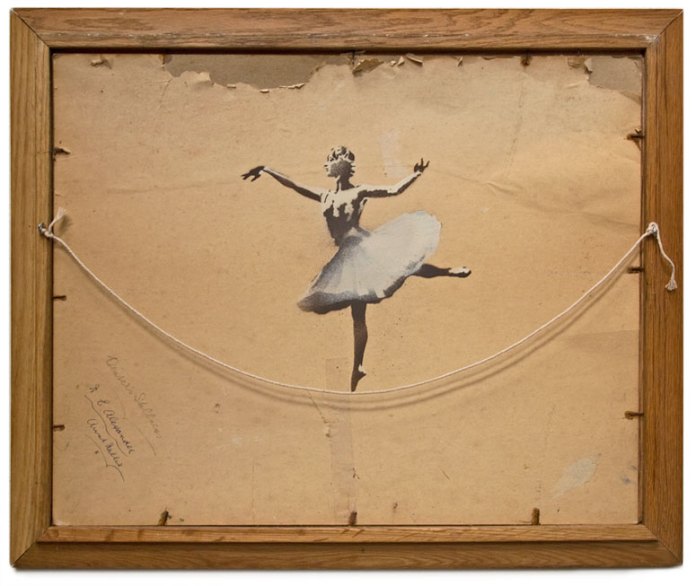 Artwork titled 'Ballerina' by Banksy from 2012. The piece features a stenciled image of a ballerina in a graceful pose, painted on the reverse side of a worn canvas with a distressed, aged surface. The ballerina appears mid-pirouette with one leg extended, her tutu and pose capturing a moment of elegance. The piece is framed in a simple wooden frame with visible nails and a string, evoking a raw, unfinished aesthetic that contrasts with the delicate subject matter.