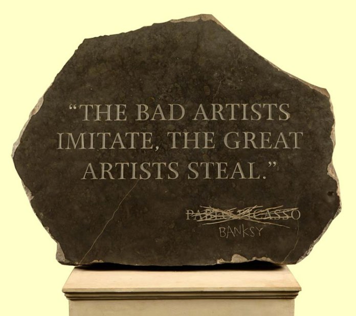 'Picasso Quote,' an artwork by Banksy displayed in the 2009 Banksy vs. Bristol Museum exhibition. The piece is a large stone slab with the inscription, 'THE BAD ARTISTS IMITATE, THE GREAT ARTISTS STEAL,' a famous quote attributed to Pablo Picasso. In a rebellious twist, the name 'Picasso' is crossed out and replaced with 'Banksy,' claiming the sentiment as his own and making a statement on originality, influence, and artistic identity