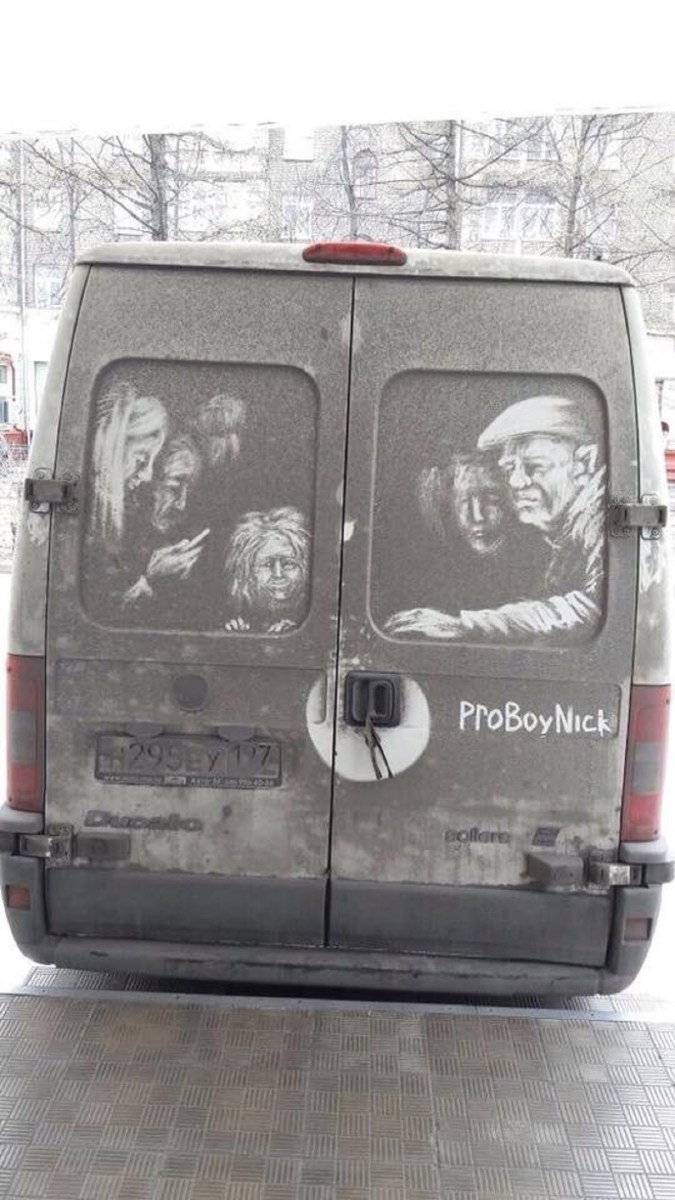 Grime art by ProBoyNick on the back of a van, featuring a haunting scene of faces peering out from the dirt. The artwork includes multiple figures, each with distinct expressions, including an elderly man in a cap, a woman with disheveled hair, and others with somber, contemplative looks. The detailed portraits are etched into the van’s grime, creating an intense, expressive scene that transforms the vehicle into a moving work of art.
