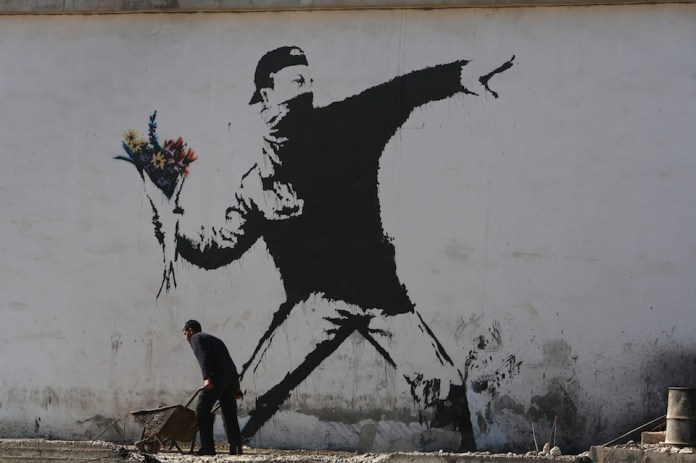 Banksy Graffiti Art On West Bank Barrier