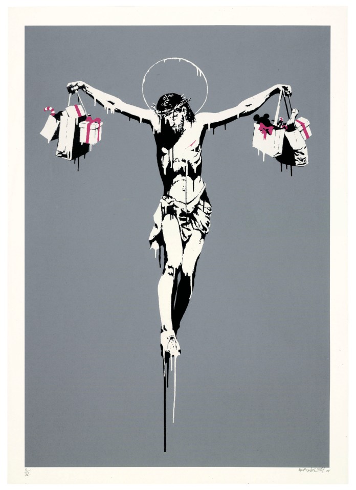 Banksy’s artwork Christ with Shopping Bags portrays a crucified figure of Christ holding shopping bags filled with Christmas-themed items like candy canes and gifts. The image critiques the commercialization of religious holidays and the materialism that overshadows their original meaning.