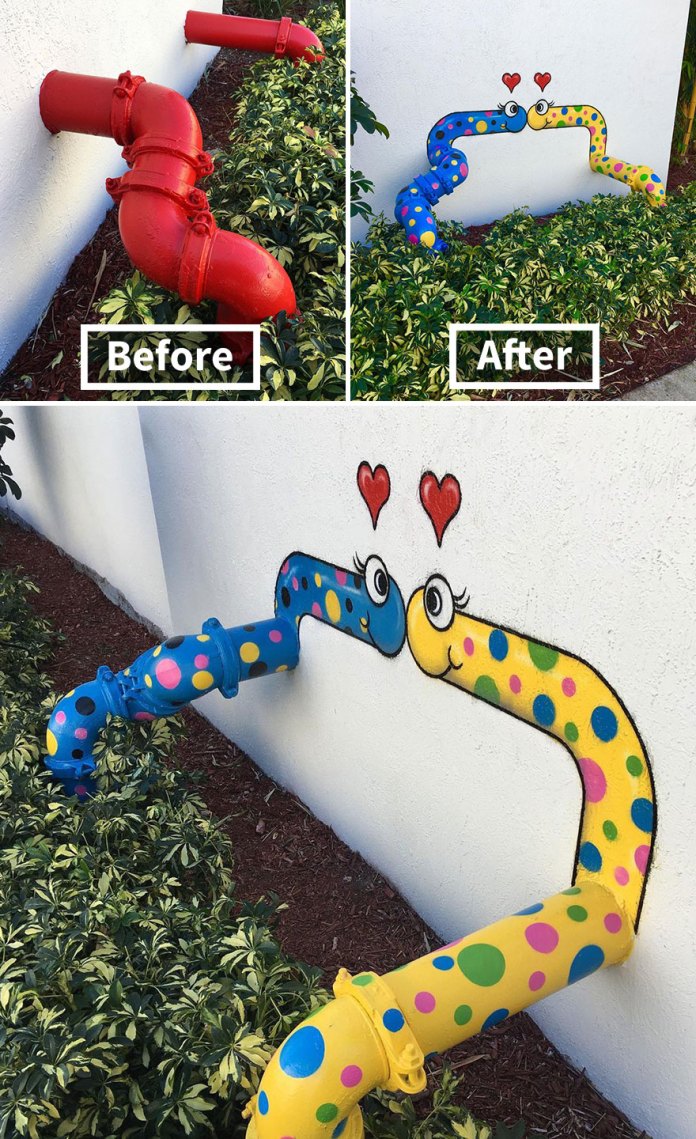 Two wall-mounted pipes painted as polka-dotted cartoon worms in love, with eyes and hearts, transforming plain red pipes into playful street art.