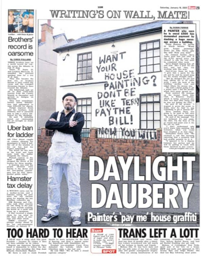 A newspaper page titled "Daylight Daubery" features Dean Reeves, a painter in white overalls, standing with his arms crossed in front of a cream-colored building in Bolsover. The building’s facade prominently displays a black graffiti message: "Want your house painting? Don’t be like Terry, pay the bill! Now you will!"
