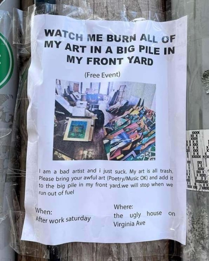 A printed flyer taped to a wooden post with bold text inviting people to a free event where someone plans to burn all their own artwork in the front yard, including a photo of art pieces scattered on the floor.