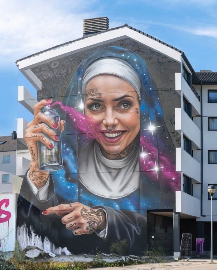 Mural by SFHIR in Ferrol, Spain, for Meninas de Canido. The artwork depicts a modernized version of Marcela de Ulloa, a widow from Velázquez's "Las Meninas," reimagined as a tattooed, pierced nun spray-painting graffiti. The mural challenges societal norms and stigmas tied to aesthetics and roles.