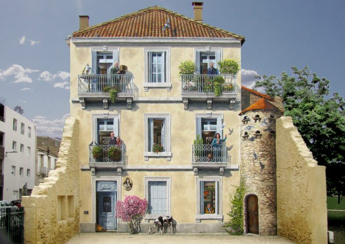 An intricate trompe-l'œil mural by artist Patrick Commecy in Montpellier, France, transforming a blank wall into the realistic facade of a three-story building. The painted building features lifelike details: balconies with people interacting, lush potted plants, a blossoming tree near the entrance, and a stone tower adorned with birds. The vibrant scene creates an illusion of depth and activity, blending seamlessly with the surrounding architecture and adding charm and vitality to the area.