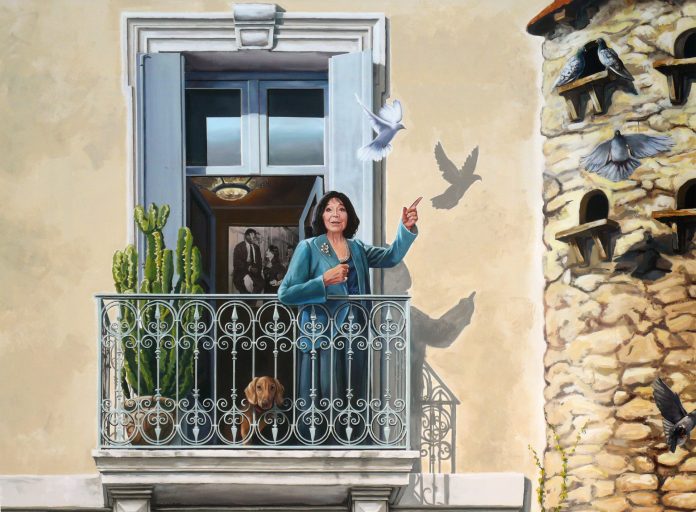 A captivating section of Patrick Commecy's mural in Montpellier, France, depicting a woman standing on a balcony, gesturing towards a flock of doves. The woman, dressed in a blue outfit with embroidered details, has an expression of gentle amazement as she points at the birds. Beside her on the balcony railing sits a small dog gazing outward, while a cactus plant adds a touch of greenery. The intricate wrought iron railing adds to the realistic feel of the mural. In the background, through the open window, a framed black-and-white photo of a man and woman can be seen, adding a nostalgic element to the scene. The mural beautifully integrates nature with architecture, as shadows of doves fly across the adjacent wall.