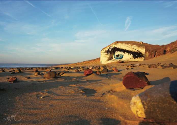 Graffiti mural by Näutil of a eye at beach in Siouville-Hague, France.