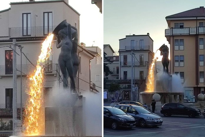 A side-by-side comparison of the Fontana Luminosa in L'Aquila, Italy. On the left, a close-up shows sunlight illuminating the water, creating the illusion of molten lava flowing from the sculpture. On the right, a wider view captures the fountain glowing amidst the urban surroundings at sunset, framed by cars, buildings, and people. Sculpted by Nicola D'Antino in the 1930s, the fountain blends art and natural light to create this stunning effect.