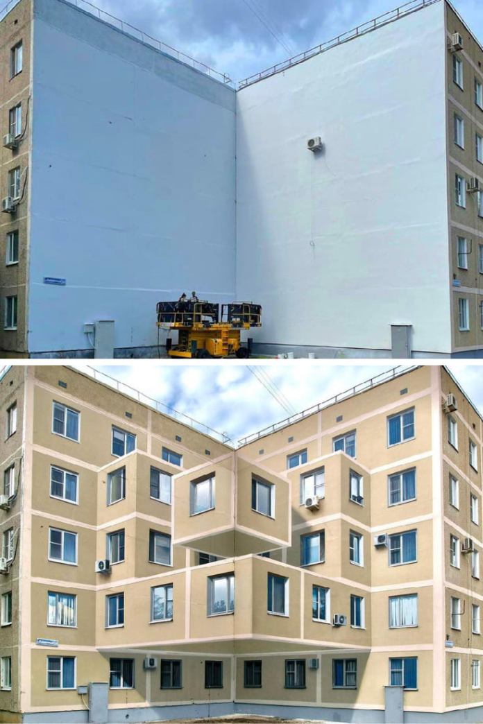 A blank white wall is transformed into what looks like a three-dimensional apartment building façade with protruding cube-shaped balconies. The optical illusion is only visible from a specific viewing angle.
