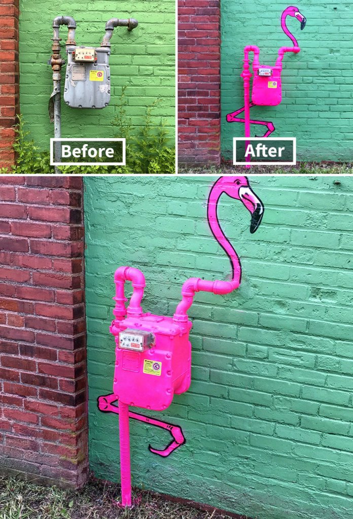 A bright pink flamingo street art painted on and around a gas meter and pipes against a green brick wall, creating a whimsical bird figure in Massachusetts, USA.