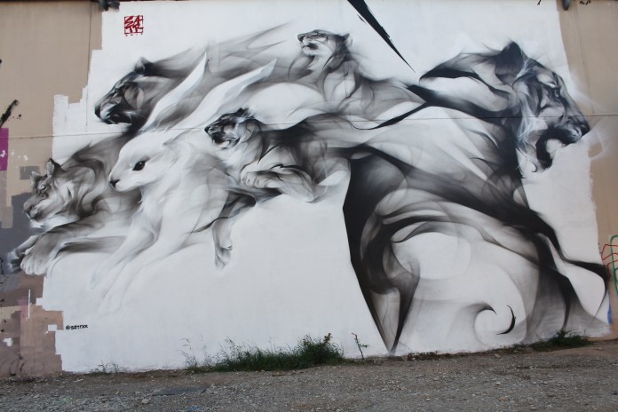 Street Art by SatrXX - In Lyon, France. Photo by meuh1246.