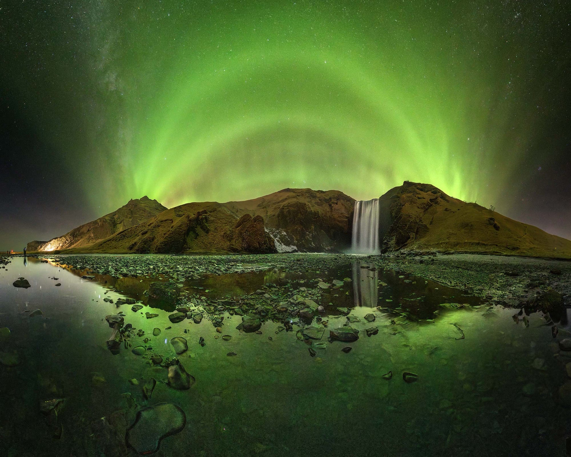 Victor Lima, “A Cathedral of Green Light Rising Over Skógafoss”