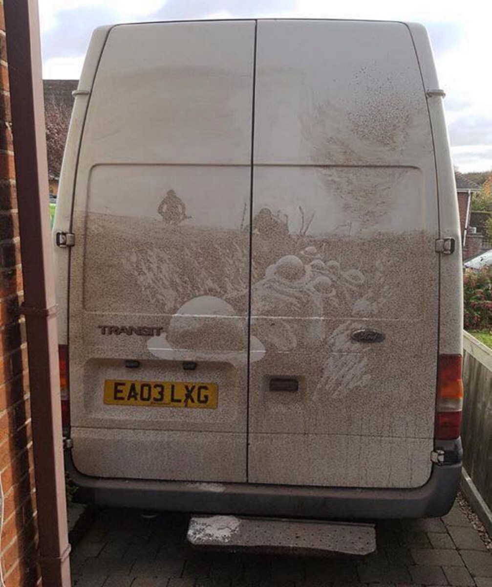 A battlefield scene with soldiers etched into the dirt on a Ford Transit van