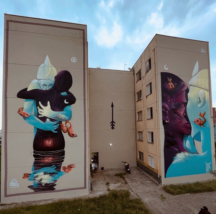 Two large murals by Davi DMS on apartment buildings in São Paulo, Brazil, showing surreal blue and purple figures with moons, water, and small fish.