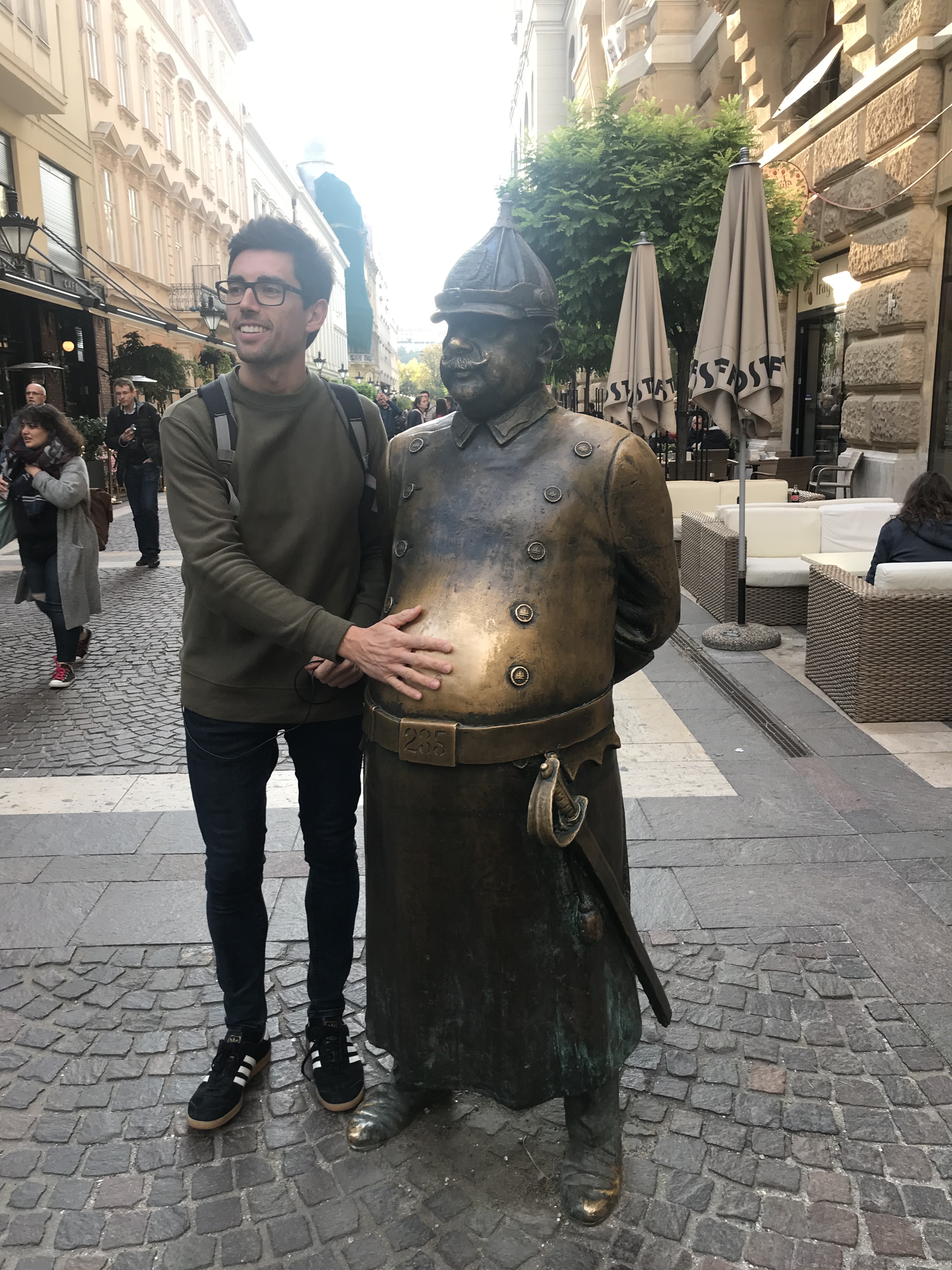A street statue of a rotund policeman.