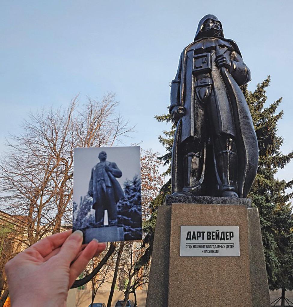 Darth Vader statue in Odesa, Ukraine, converted from a Lenin monument by Alexander Milov, shown on a pedestal while a hand holds an older photo of the original statue.