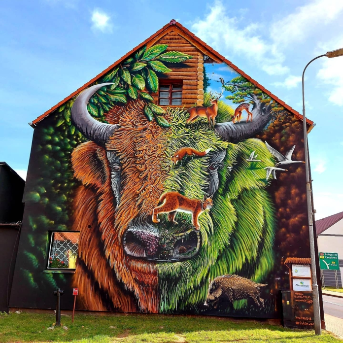 A breathtaking street art mural of wildlife and forest animals. Painted by Cukin Koszalin in Miroslawiec, Poland. A beautiful tribute to local nature and graffiti art.