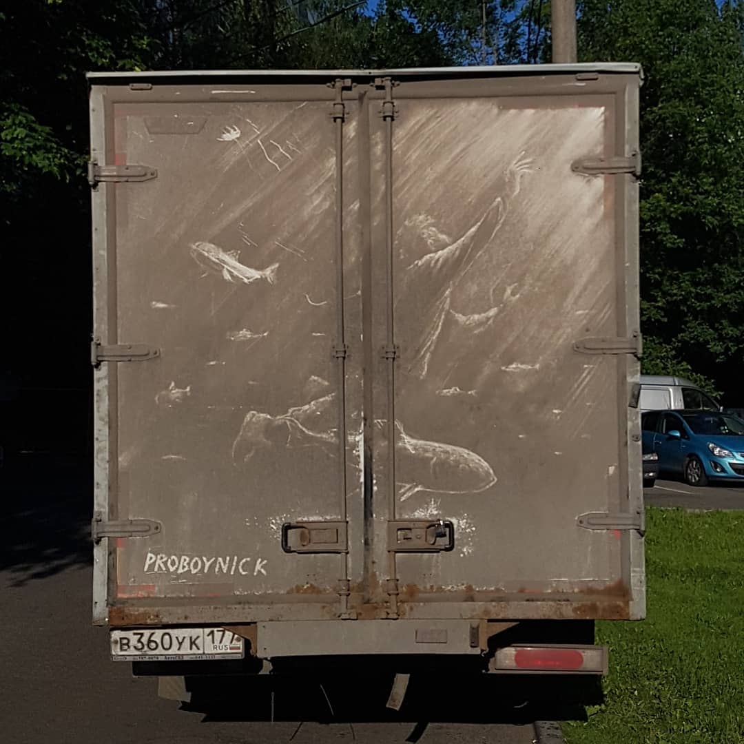 Grime artwork on a van showing underwater scene with a human figure reaching upward, surrounded by fish and light rays, created by ProBoyNick in Moscow.