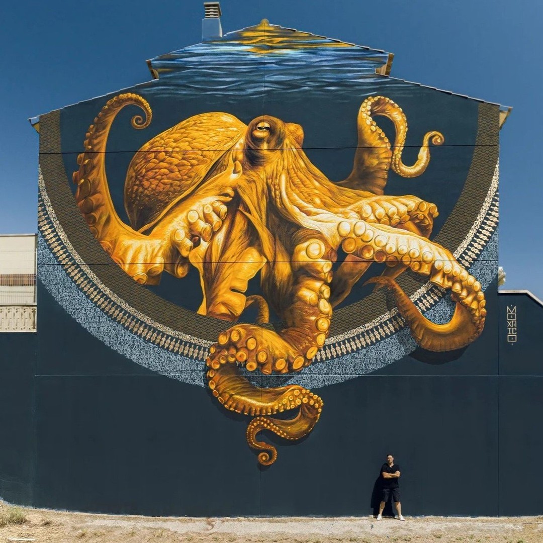Mural of golden Octopus by Moxaico in L'Ametlla de Mar, Spain for Festival EFÍMURS.