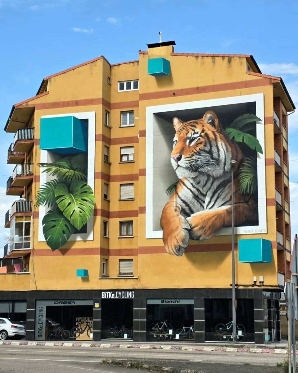 Realistic tiger mural on a building in Spain