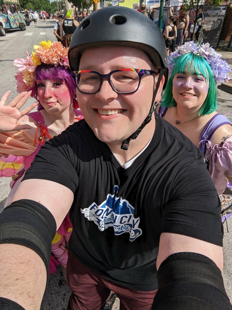 Picture of me skating at Pride parade, eye contact