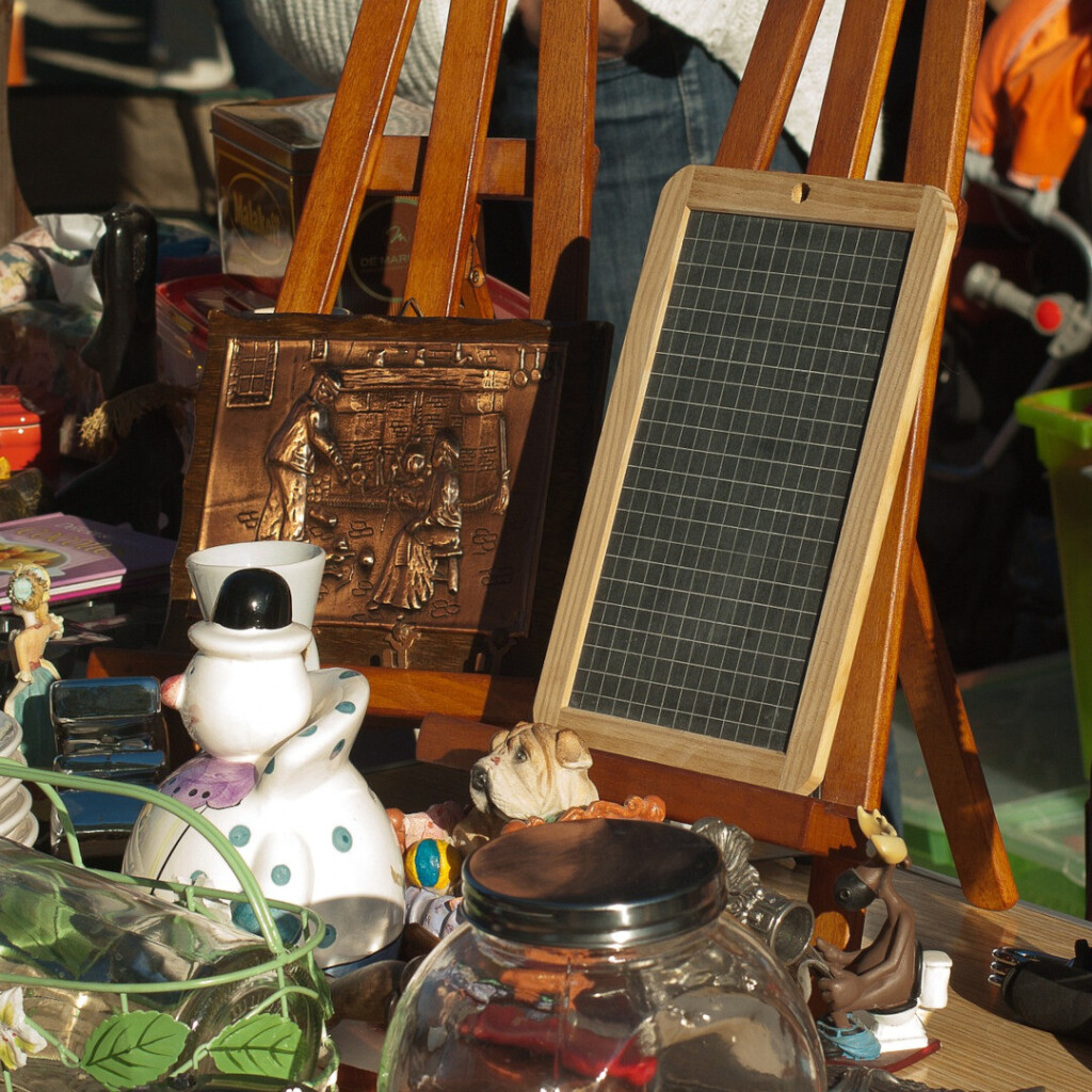 A variety of items for sale that are spread out on a table