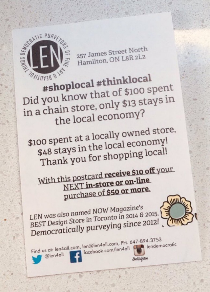 Notice from local Hamilton, Ontario store on the benefits of shopping locally to local economies.