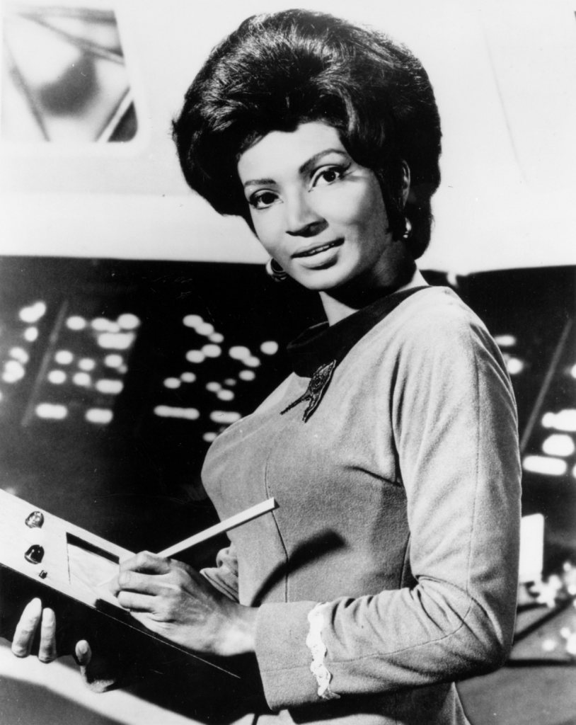 Black and white photo of Nichelle Nichols as lieutenant Uhura in Star Trek.