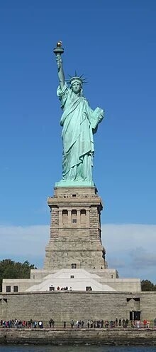 Full height photograph of the statute of liberty.