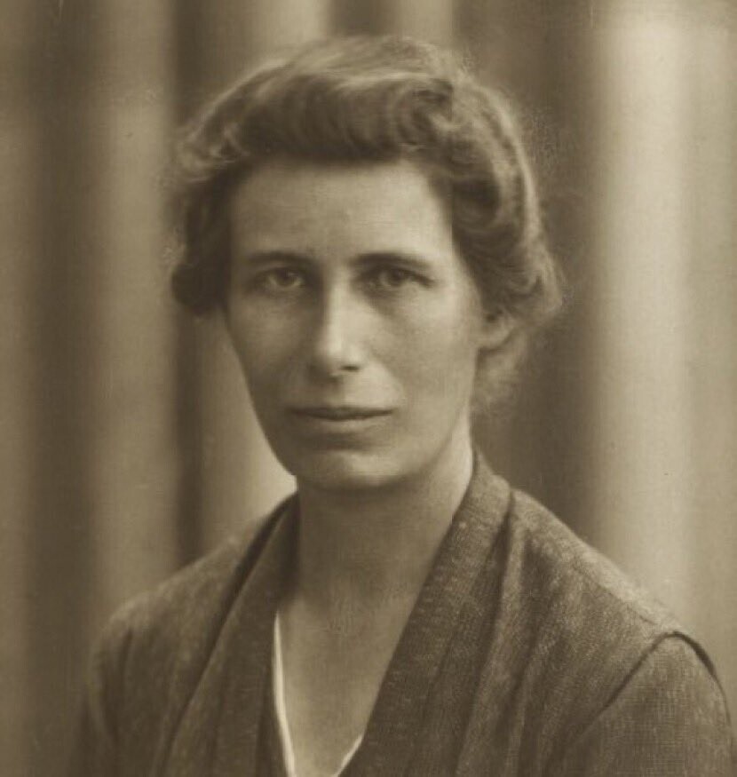 Sepia-tinted black and white photo of Inge Lehmann. She is looking directly at the camera, with a neutral expression.