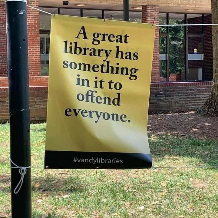 A sign (presumably outside a library) that says: A great library has something in it to offend everyone.