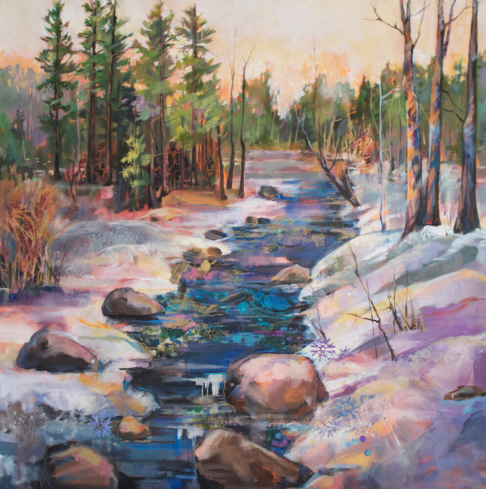 Painting of a dark blue creek with some brown rocks, with a pink glow over them, in it. Further back there are touches of purple in the water. The soil on both sides of the creek is covered with snow. The snow has a glow over it in shades of blue, purple, yellow and pink. On the right are three leaveless trees. On the left are some green trees. In the background is a row of green trees. The sky is coloured in soft shades of pink, yellow and orange.