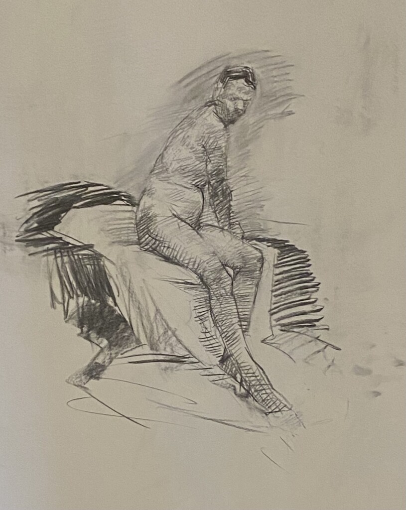 Drawing of a male nude done in charcoal and in a seated position.