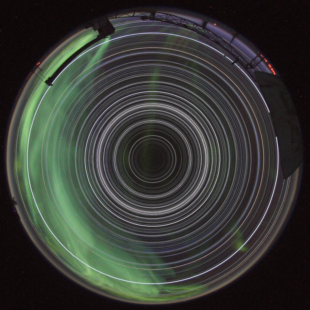 2012 August 2

South Pole Star Trails
 * Image Credit & Copyright: Robert Schwarz (South Pole Station)

Explanation: 
No star dips below the horizon and the Sun never climbs above it in this remarkable image of 24 hour long star trails. Showing all the trails as complete circles, such an image could be achieved only from two places on planet Earth. This example was recorded during the course of May 1, 2012, the digital camera in a heated box on the roof of MAPO, the Martin A. Pomerantz Observatory at the South Pole. Directly overhead in the faint constellation Octans is the projection of Earth's rotational axis, the South Celestial Pole, at the center of all the star trail circles. Not so well placed as Polaris and the North Celestial Pole, the star leaving the small but still relatively bright circle around the South Celestial Pole is Beta Hydri. The inverted umbrella structure on the horizon at the right of the allsky field of view is the ground shield for the SPUD telescope. A shimmering apparition of the aurora australis also visited on this 24 hour night. 

Authors & editors: Robert Nemiroff (MTU) & Jerry Bonnell (UMCP)
NASA Official: Phillip Newman Specific rights apply.
NASA Web Privacy Policy and Important Notices
A service of: ASD at NASA / GSFC
& Michigan Tech. U.