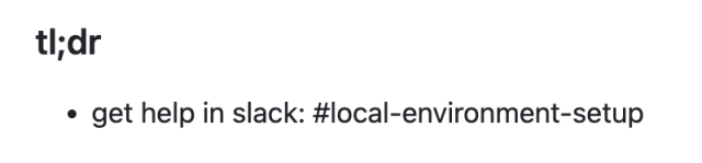 A partial screenshot of a GitHub repo README file that reads: "tl;dr get help in slack: #local-environment-setup"