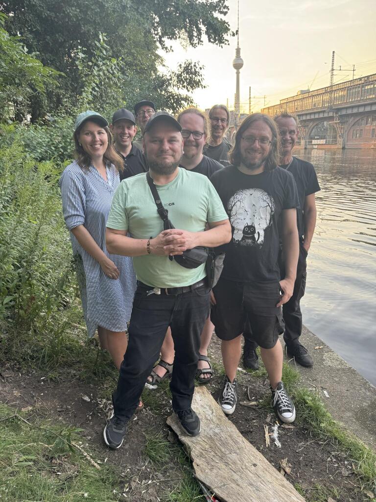 Some girls and guys from the core team behind behind the scenes, The TV tower can be seen in the background in Berlin.