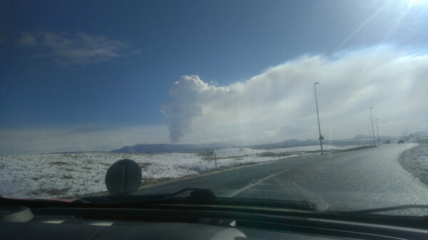 Same volcanic eruption cloud seen from a different perspective. Long tail downwind cloud visible behind it.