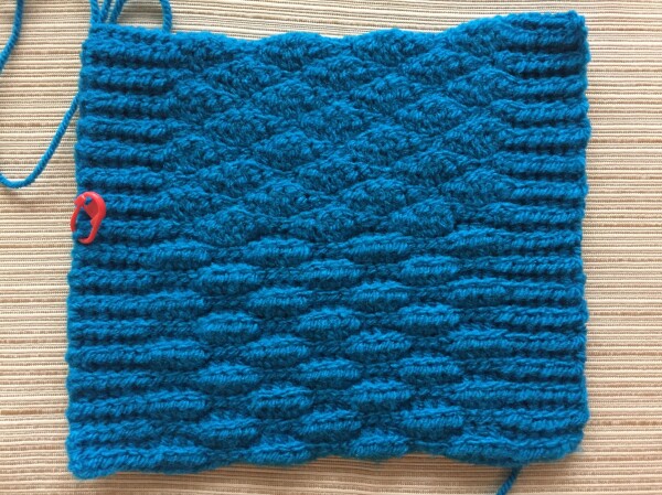 Back of the same swatch, original on the bottom and my version on top. The bottom has alternating raised bumps, the top is flatter with subtle diamond shapes.