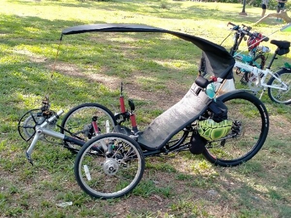 Photo of a reclining trike, modified to have a roof over the rider