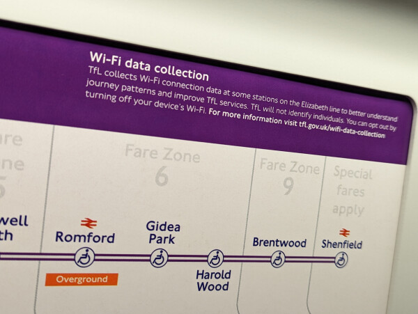 A sign that says: "Wi-Fi data collection TfL collects Wi-Fi connection data at some stations the Elizabeth line to better understand journey patterns and improve TfL services. TfL will not identify individuals. You can opt out by turning off your device's Wi-Fi. For more information visit tfl.gov.uk/wifi-data-collection"