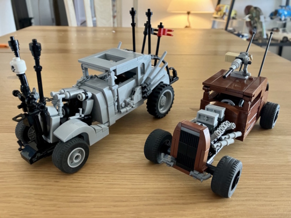 A couple of custom LEGO sets from the movie Mad Max: Fury Road. On the left, the gray hot rod driven by Nux. On the right, a rusted brown scout car called The Elvis after Ian "Elvis" Davis, the designer of the hot rod it's inspired from.