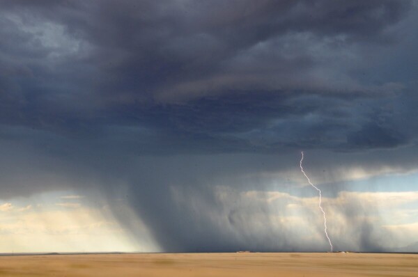 Photo of a rainstorm as it begins to hit the ground, activating the bacteria that produce the distinctive "smell of rain."