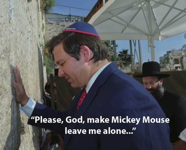 Ron DeSantis praying at the wailing wall with a yarmulke embroidered with his name.

Caption reads "Please god make mickey mouse leave me alone."